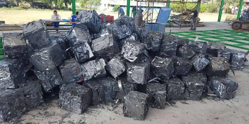 A compact and dense metal bale created by a BALEWELL metal baler in Thailand, showcasing the efficiency of the baling process.